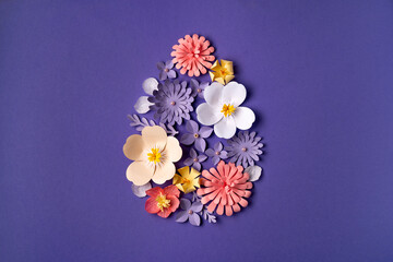 Floral Easter background with egg shape design. Paper art and handcraft. Trendy very peri color. Flower pattern