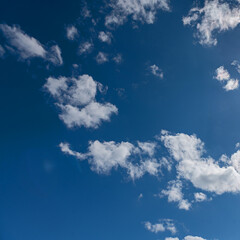 bright summer sky with a group of white clouds as a natural background