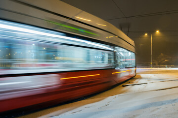 Fototapeta na wymiar Red tram in motion.
