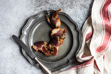 Overhead view of slices of traditional Georgian Lori bacon from Racha region, Georgia