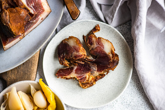 Traditional Georgian Lori bacon and pickled chilli peppers from Racha region, Georgia