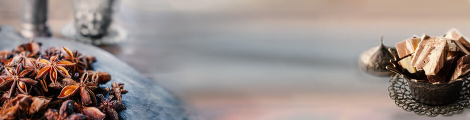 Anise seeds on a wooden board close-up. Banner, copy of the space