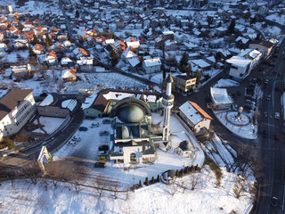 An aerial shot of the cityscape view of Sarajevo covered with the snow in Bosnia and Herzegovina