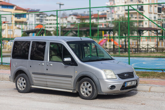 Side, Turkey -January 28, 2022: silver Toyota Trueno  is parked  on the street on a warm  day against the backdrop of a  basketball playground, park