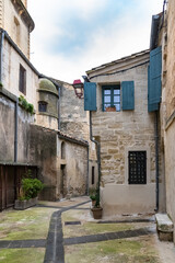 Sommieres, medieval village in France, view of typical street and houses
