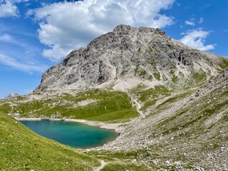 Panoramic view of emerald-green Butzensee in Arlberg region, close to Lech. Vorarlberg, Austria.