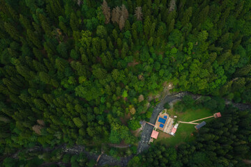 Sulfur baths in the Borjomi mineral water resort in summer. Hot spring pool in the mountains in the...