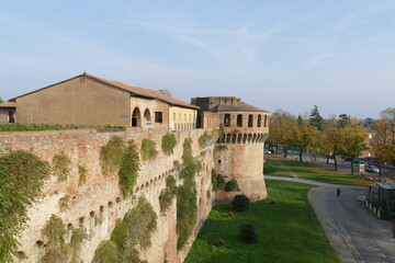 panorama of the walls, of the towers and of the green lawn from the raised patrol walkways of Sforza Castle in Imola