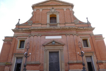 San Cassiano Cathedral in Imola, facade made with red bricks and bell tower