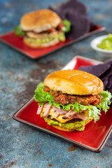 Ham and Cheese Breakfast Burger on top Guacamole