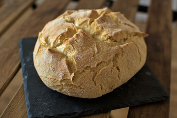 Rustic bread on stone board