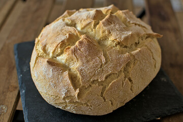 Rustic bread on stone board