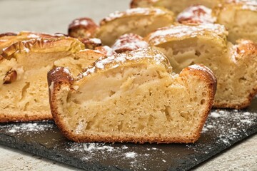 Apple cake made from fresh apples sprinkled with powdered sugar