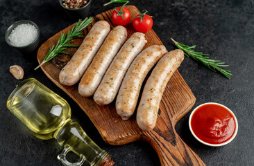grilled sausages on stone background