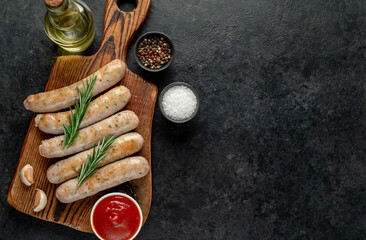 grilled sausages on stone background with copy space for your text