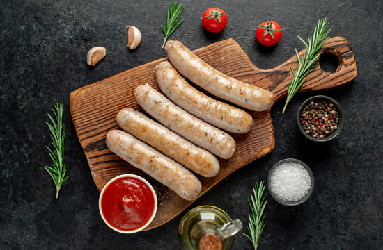 grilled sausages on stone background