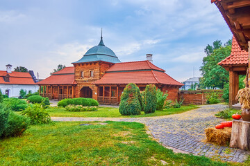 The scenic wooden Gatehouse and cozy garden of Bohdan Khmelnytsky Residence, Chyhyryn, Ukraine