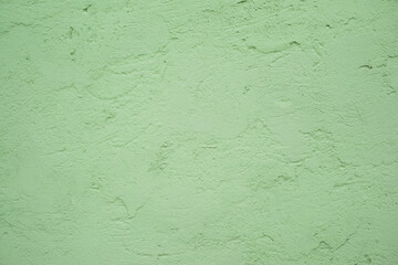 Green rough plastered texture wall, background. 