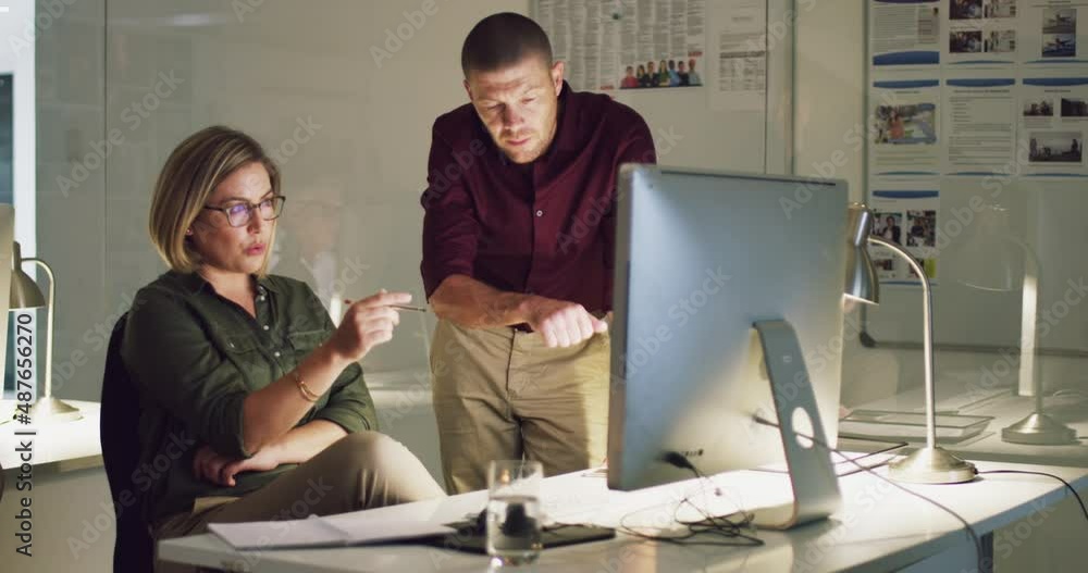 Aufkleber Getting each others take on the project at hand. 4k video of two colleagues working late on a computer in an office.