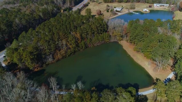 Completed aerial drone view of triangle lake surround by trees
