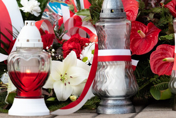Red and white candles in the colors of the Polish flag, national anniversary in Poland. Polish national colors.