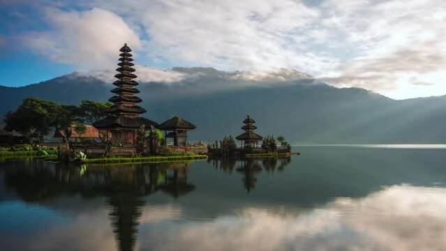 Bali, Indonesia, time lapse view of iconic Pura Ulun Danu Bratan temple at sunrise. 