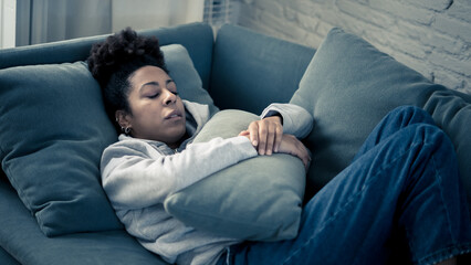 Depressed and distressed african american woman feeling lonely, sad and exhausted