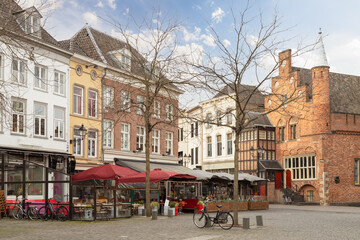 Old houses and cozy restaurants on the market square in the center of Den Bosch.