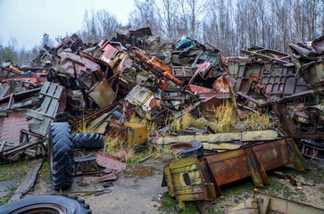 Piles of old rusty soviet crushed trucks in scrap metal yard. Car recycling