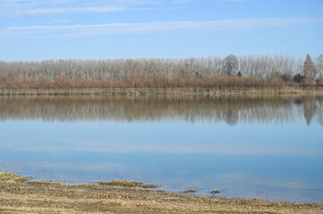 Sava River in winter. Sky reflected in water.