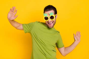 Photo of youth excited guy have fun dancer eyewear tropical theme-party isolated over yellow color...