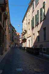Fototapeta na wymiar Cobblestone street with buildings, Verona, Italy