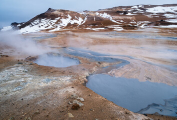 The Namafjall Geothermal Area, Iceland, on the east side of Lake Myvatn. At this area, also known as Hverir, are many smoking fumaroles, boiling mud pots and sulphur crystals.