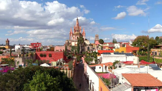 Aerial view of San Miguel de Allende, Mexico, including historic landmark Parroquia de San Miguel Arcangel on a sunny day.