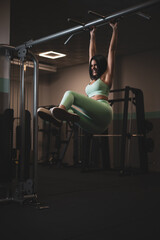 A pretty girl training in a gym.