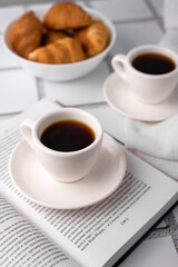 coffee and croissants, chocolate cream, french press on the table, morning breakfast 