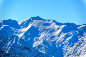 Fototapeta na wymiar Austrian Alps covered with fresh snow during sunny winter day.