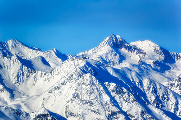 Panoramically view over Austrian Alps covered with snow on altitude higher than 2000 meters above...