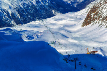Panoramically view from 3030 meters above sea level over snowy valley with  ski lift in Hochgurgl,...