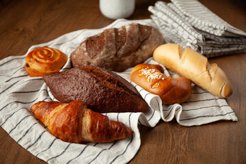 Assortment of fresh golden baked goods. Bread and buns.