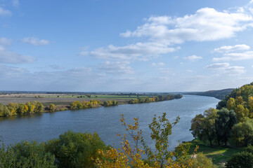 Autumn landscape with a view of the river and endless expanses of fields. Panoramic landscape with...