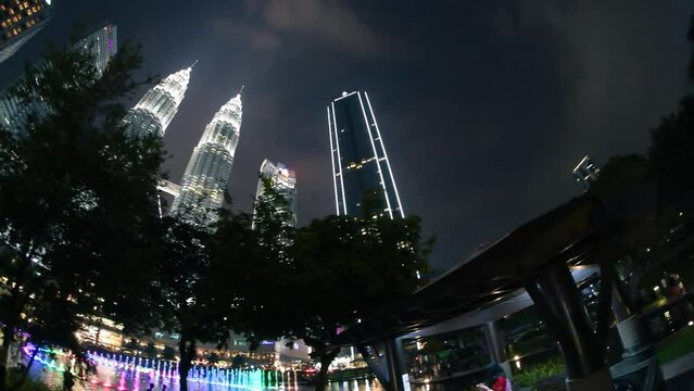 Kuala Lumpur, Malaysia - December 27, 2019: Night panoramic view of Petronas Twin Towers and city park