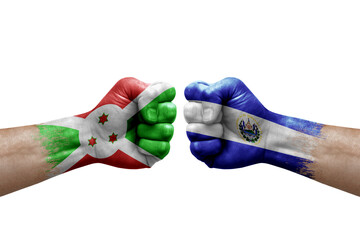 Two hands punch to each others on white background. Country flags painted fists, conflict crisis concept between burundi and el salvador