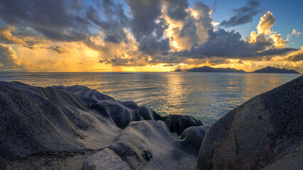 sunset at tropical beach anse georgette on praslin on the seychelles
