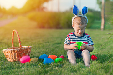 Toddler eggs hunters close-up. Children activity for Easter in nature..