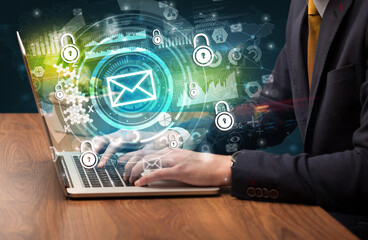 Business hand typing on a modern laptop