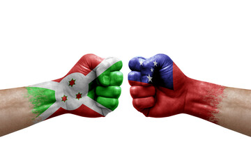 Two hands punch to each others on white background. Country flags painted fists, conflict crisis concept between burundi and samoa