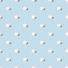 White pills on a blue background. Seamless pattern for the background. Medical pharmacy flat lay design for presentation packaging website flyer cover business cards.