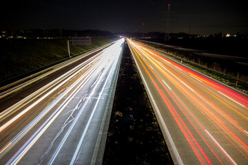 Fototapeta na wymiar travel germany and bavaria, view at a german highway at night with traffic