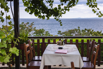 Table in restaurant in Old Town of Nesebar historic city on a Black Sea shore in Bulgaria